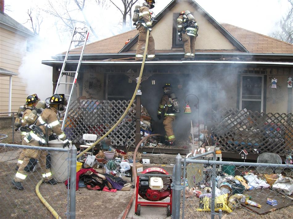 Firefighters Work to Extinguish Structure Fire on Adams Street
